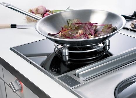 Picture of someone cooking with a Gaggenau Induction Cooktop, Wok Capable