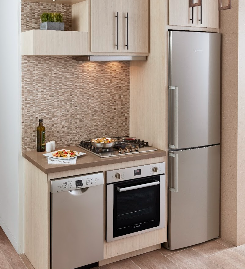 Picture of large fridge in tan kitchen